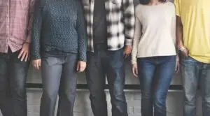 4 adults standing in a row