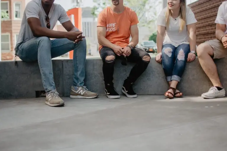 Young people sitting down to chat